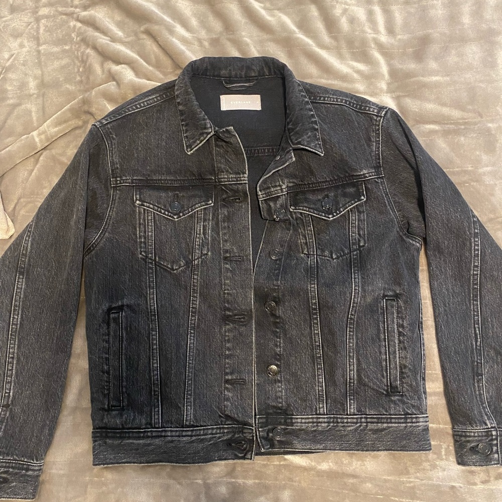 Faded black denim jacket by Everlane.